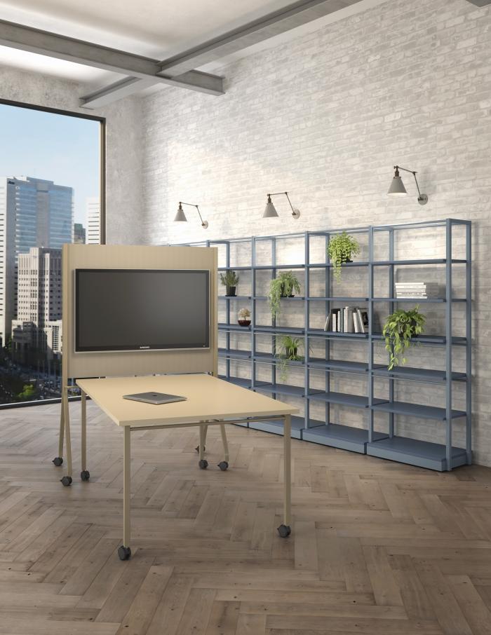 Latch table, bookshelves and media wall in an office setting