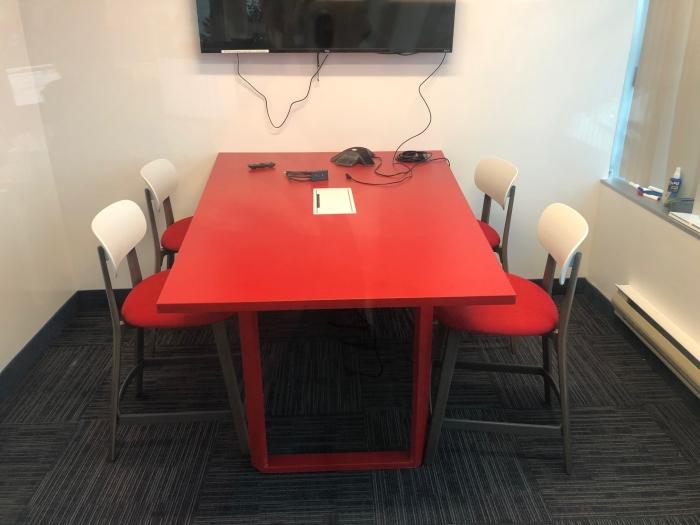 Spec Furniture Askew table in a meeting room, red